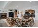Open basement featuring a fireplace, a bar, and comfortable seating at 9278 E Aspen Hill Pl, Lone Tree, CO 80124