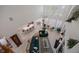 Open-concept living area with white tile floors, comfortable seating, and large windows at 9278 E Aspen Hill Pl, Lone Tree, CO 80124