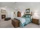 Comfortable main bedroom featuring a fireplace and seating area, creating a cozy retreat at 9278 E Aspen Hill Pl, Lone Tree, CO 80124