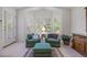 Bright sitting area with shuttered windows and comfortable seating, creating a cozy reading nook at 9278 E Aspen Hill Pl, Lone Tree, CO 80124