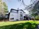 Two-story home boasts large backyard, multi-level deck, and multiple windows for bright interiors at 5126 S Kenton Way, Englewood, CO 80111