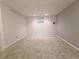 Spacious basement offers potential for customization, with neutral carpet, and good lighting at 5126 S Kenton Way, Englewood, CO 80111