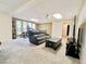 Finished basement features a cozy sitting area, fitness equipment, and natural light from large windows at 5126 S Kenton Way, Englewood, CO 80111