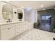 Bright bathroom with double sink vanity, soaking tub and walk-in shower at 5126 S Kenton Way, Englewood, CO 80111