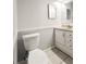 Clean and simple bathroom with neutral tile flooring, standard fixtures, and efficient layout at 5126 S Kenton Way, Englewood, CO 80111