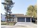 Charming two-story home with a large driveway and an attached three-car garage at 5126 S Kenton Way, Englewood, CO 80111