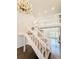 Elegant foyer with a grand staircase and chandelier at 5126 S Kenton Way, Englewood, CO 80111