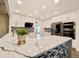 Stylish kitchen with quartz countertops, white cabinets, and stainless steel appliances at 5126 S Kenton Way, Englewood, CO 80111