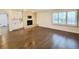 Spacious living room with a brick fireplace and built-in cabinets at 5126 S Kenton Way, Englewood, CO 80111