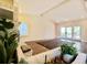 Open concept living room featuring a vaulted ceiling and access to outdoor patio at 5126 S Kenton Way, Englewood, CO 80111