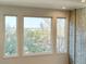 Large windows providing ample natural light and views of green tree tops at 5126 S Kenton Way, Englewood, CO 80111