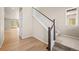Bright entryway featuring hardwood floors and a staircase at 5936 N Lisbon St, Aurora, CO 80019