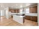 Spacious kitchen with stainless steel appliances and a large island at 5936 N Lisbon St, Aurora, CO 80019