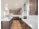 Spacious kitchen featuring quartz countertops, stainless steel appliances, and ample cabinet space at 5936 N Lisbon St, Aurora, CO 80019