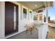 Cozy front porch with seating, perfect for relaxing and enjoying the neighborhood views at 5936 N Lisbon St, Aurora, CO 80019
