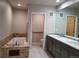 Bathroom featuring a large soaking tub and double sinks at 656 County Road 72, Bailey, CO 80421