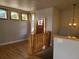 Inviting foyer with hardwood floors, rustic log railing, and ample natural light at 656 County Road 72, Bailey, CO 80421