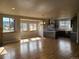Open-concept living and kitchen area with hardwood floors and beautiful views at 656 County Road 72, Bailey, CO 80421
