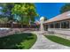 Stunning backyard with a stone pathway, stone retaining wall and manicured lawn at 5672 S Hanover Way, Greenwood Village, CO 80111