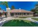 View of a gorgeous backyard, with luscious green grass, concrete and stone features at 5672 S Hanover Way, Greenwood Village, CO 80111