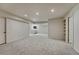 Large finished basement area with recessed lighting, neutral carpet, and ample space for recreation and activities at 5672 S Hanover Way, Greenwood Village, CO 80111