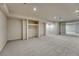 Spacious basement area with neutral carpet, recessed lighting, and a flexible layout for customization at 5672 S Hanover Way, Greenwood Village, CO 80111