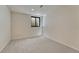 Carpeted basement bedroom with a window for natural light, and neutral walls to match all decor at 5672 S Hanover Way, Greenwood Village, CO 80111