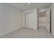 Bedroom featuring neutral carpet, double closets, and a bright aesthetic at 5672 S Hanover Way, Greenwood Village, CO 80111