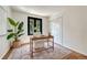 Bright bedroom featuring a writing desk and large potted plant at 5672 S Hanover Way, Greenwood Village, CO 80111