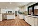 Open kitchen with granite countertops, stainless steel appliances, hardwood floors, and lots of light at 5672 S Hanover Way, Greenwood Village, CO 80111