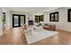 Bright living room features hardwood floors, fireplace, and French doors to the backyard at 5672 S Hanover Way, Greenwood Village, CO 80111