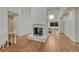 Living room with a fireplace, skylight, hardwood floors and white walls at 5672 S Hanover Way, Greenwood Village, CO 80111
