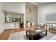 Cozy living room with a bar, fireplace, and hardwood floors at 5672 S Hanover Way, Greenwood Village, CO 80111