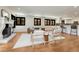 Bright living room with hardwood floors, fireplace, and large windows allowing lots of natural light at 5672 S Hanover Way, Greenwood Village, CO 80111