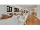 Spacious living room featuring hardwood floors, black-framed windows, and open to the kitchen at 5672 S Hanover Way, Greenwood Village, CO 80111