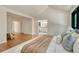 Spacious bedroom with hardwood floors and modern decor with an attached bathroom at 5672 S Hanover Way, Greenwood Village, CO 80111