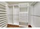Organized walk-in closet with built-in shelving, drawers, and hanging rods at 5672 S Hanover Way, Greenwood Village, CO 80111