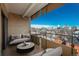 Relaxing balcony with comfortable seating offering city views and a blue sky at 800 N Pearl St # 611, Denver, CO 80203