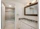 Clean bathroom with modern vanity, framed mirror and tiled shower at 800 N Pearl St # 611, Denver, CO 80203