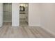 Bright bedroom featuring light wood flooring and an ensuite bathroom for added convenience at 800 N Pearl St # 611, Denver, CO 80203