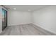 Bright bedroom with wood flooring, ample lighting and large sliding glass door at 800 N Pearl St # 611, Denver, CO 80203