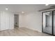 Bedroom with wood floors, closet, and sliding glass doors to a balcony at 800 N Pearl St # 611, Denver, CO 80203