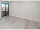 Bedroom featuring light wood floors and sliding glass door to a balcony at 800 N Pearl St # 611, Denver, CO 80203