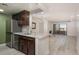 Open concept kitchen with stainless steel appliances and breakfast bar, connected to the living room at 800 N Pearl St # 611, Denver, CO 80203