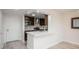 Open kitchen featuring a breakfast bar, stainless appliances, and modern fixtures at 800 N Pearl St # 611, Denver, CO 80203