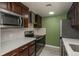 Well-equipped kitchen with modern stainless steel appliances and white countertops at 800 N Pearl St # 611, Denver, CO 80203