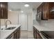 Contemporary kitchen features stainless appliances, white countertops, and ample cabinet space at 800 N Pearl St # 611, Denver, CO 80203