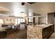 Lounge area and kitchenette featuring granite countertops, seating, and modern decor at 800 N Pearl St # 611, Denver, CO 80203