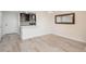 Bright living room featuring wood floors, and a view of the kitchen at 800 N Pearl St # 611, Denver, CO 80203