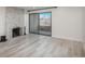 Living room featuring a fireplace and sliding doors with city views at 800 N Pearl St # 611, Denver, CO 80203